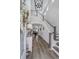 Grand foyer with hardwood floors, staircase, and stylish decor at 1756 Timmons St, Mount Pleasant, SC 29466