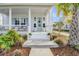 Inviting front porch with seating, decor, and lush landscaping at 1756 Timmons St, Mount Pleasant, SC 29466