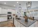 Kitchen showcases stainless steel appliances, granite countertops, and a center island with chairs at 1756 Timmons St, Mount Pleasant, SC 29466