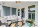 Cozy sunroom with a comfortable seating, neutral tones, and natural light at 1756 Timmons St, Mount Pleasant, SC 29466