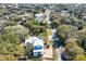 Aerial view showcases the neighborhood and the charming two-story home with a light metal roof at 18 Wills Way, Isle of Palms, SC 29451
