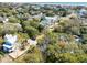 Aerial view featuring the home's light colored siding, roof, and surrounding foliage at 18 Wills Way, Isle of Palms, SC 29451