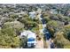 Aerial view showcases the neighborhood and the charming two-story home with a light metal roof at 18 Wills Way, Isle of Palms, SC 29451