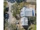 An aerial perspective showcases the new home's roofing and surrounding landscape during construction at 18 Wills Way, Isle of Palms, SC 29451