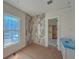 Bathroom featuring newly tiled shower and walk-in closet at 18 Wills Way, Isle of Palms, SC 29451