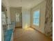 Bright bathroom with a large window and elegant marble accents at 18 Wills Way, Isle of Palms, SC 29451