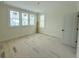 Bedroom with three windows and a door, ready for customization at 18 Wills Way, Isle of Palms, SC 29451