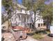 Exterior view of the home featuring light colored siding and a porch at 18 Wills Way, Isle of Palms, SC 29451