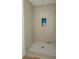 Shower featuring neutral subway tile with a built in niche at 18 Wills Way, Isle of Palms, SC 29451