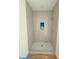 Modern shower featuring beautiful gray tiling and a built-in niche at 18 Wills Way, Isle of Palms, SC 29451