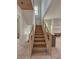 A newly constructed staircase with wood treads and cable railing at 18 Wills Way, Isle of Palms, SC 29451