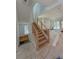 Open stairs with natural light and modern railing lead to the second floor at 18 Wills Way, Isle of Palms, SC 29451