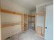 Spacious walk-in closet featuring custom wooden shelving at 18 Wills Way, Isle of Palms, SC 29451