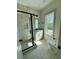 Bright bathroom featuring tiled shower, vanity, toilet, and a window offering natural light at 1818 Orangeburg St, North Charleston, SC 29405