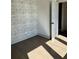 Empty bedroom with wood floors and patterned wallpaper on the wall at 1818 Orangeburg St, North Charleston, SC 29405