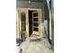 Inviting front entrance features a yellow-framed door, stylish planters, and a 'hello' welcome mat at 1818 Orangeburg St, North Charleston, SC 29405