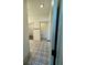 Hallway with closet and bathroom access with custom black and white tiling at 1818 Orangeburg St, North Charleston, SC 29405