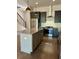 Modern kitchen featuring stainless steel appliances, granite countertops, an island, and dark cabinets at 1818 Orangeburg St, North Charleston, SC 29405