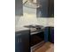 The kitchen features stainless steel appliances, granite countertops, and backsplash at 1818 Orangeburg St, North Charleston, SC 29405
