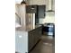 Modern kitchen featuring stainless steel appliances, granite countertops, an island, and dark cabinets at 1818 Orangeburg St, North Charleston, SC 29405