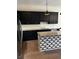 Modern kitchen featuring stainless steel refrigerator, dark cabinets, and kitchen island at 1818 Orangeburg St, North Charleston, SC 29405