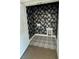 Unique laundry room featuring patterned wallpaper, patterned tile flooring, and hookups for a washer and dryer at 1818 Orangeburg St, North Charleston, SC 29405