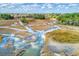 Scenic aerial view showcasing the unique marsh landscape and intricate waterways at 1818 Orangeburg St, North Charleston, SC 29405