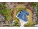Aerial view of a private backyard, driveway and surrounding landscape showcasing a well-maintained yard and fence at 1880 Bacons Bridge Rd, Summerville, SC 29485