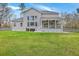 Spacious backyard with lush green lawn and patio with outdoor grill, perfect for entertaining and relaxation at 1880 Bacons Bridge Rd, Summerville, SC 29485