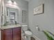 Chic half bathroom with granite countertop vanity, modern fixtures, and decorative accents at 1880 Bacons Bridge Rd, Summerville, SC 29485