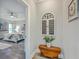 Open doorway to the bedroom, showcasing a hardwood floor, and a beautiful bed with a tufted headboard at 1880 Bacons Bridge Rd, Summerville, SC 29485