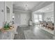 Bright entryway leads to dining room with hardwood floors, elegant chandelier, and neutral decor at 1880 Bacons Bridge Rd, Summerville, SC 29485
