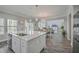 Open concept kitchen and dining area with hardwood floors and views of living room at 1880 Bacons Bridge Rd, Summerville, SC 29485