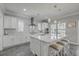 Bright kitchen with modern island, quartz countertops, stainless appliances and pendant lighting at 1880 Bacons Bridge Rd, Summerville, SC 29485