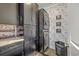 Contemporary laundry room featuring black cabinets, washer and dryer units and custom wallpaper at 1880 Bacons Bridge Rd, Summerville, SC 29485