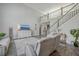 Open-concept living space with soaring ceilings, a staircase, and modern furniture arrangement at 1880 Bacons Bridge Rd, Summerville, SC 29485