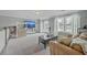 Spacious living room with a large window, providing lots of natural light, and a comfortable-looking sofa at 1880 Bacons Bridge Rd, Summerville, SC 29485