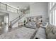 Grand living area with high ceilings, an open staircase, and clear view to the kitchen and dining area at 1880 Bacons Bridge Rd, Summerville, SC 29485