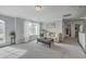 Inviting living room with plush carpeting, a comfortable sofa, and a view of the outdoors through a window at 1880 Bacons Bridge Rd, Summerville, SC 29485