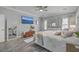 Beautifully designed main bedroom with hardwood floors, neutral decor and entertainment area at 1880 Bacons Bridge Rd, Summerville, SC 29485