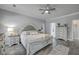 Comfortable main bedroom featuring neutral decor, hardwood floors and ensuite bathroom at 1880 Bacons Bridge Rd, Summerville, SC 29485