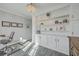 Bright office showcases built-in shelving, a modern chair, and hardwood-style floors and light gray walls at 1880 Bacons Bridge Rd, Summerville, SC 29485