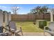 The backyard features a patio with chairs and a fenced yard, ideal for relaxing and outdoor entertainment at 2362 Parsonage Rd # 2G, Charleston, SC 29414