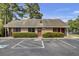 The laundry facility has a brick exterior, ample parking, and well-maintained landscaping, offering convenience for residents at 2362 Parsonage Rd # 2G, Charleston, SC 29414