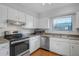 Bright kitchen featuring white cabinets and stainless steel appliances at 2362 Parsonage Rd # 2G, Charleston, SC 29414