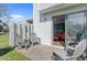 Cozy patio seating area with a glimpse of indoor living through sliding glass doors, inviting relaxation and enjoyment at 2362 Parsonage Rd # 2G, Charleston, SC 29414