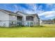 Exterior view of condo building with screened in porches and a very large yard at 2608 Hidden Cove Dr, Moncks Corner, SC 29461