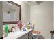 Bathroom featuring a well-lit vanity with a mirror and a toilet with decorative covering at 2608 Hidden Cove Dr, Moncks Corner, SC 29461