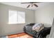 Modest bedroom features a window, a ceiling fan, and hardwood floors at 2608 Hidden Cove Dr, Moncks Corner, SC 29461
