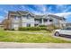 Two-story condo featuring light siding, landscaping and a designated handicap parking spot at 2608 Hidden Cove Dr, Moncks Corner, SC 29461